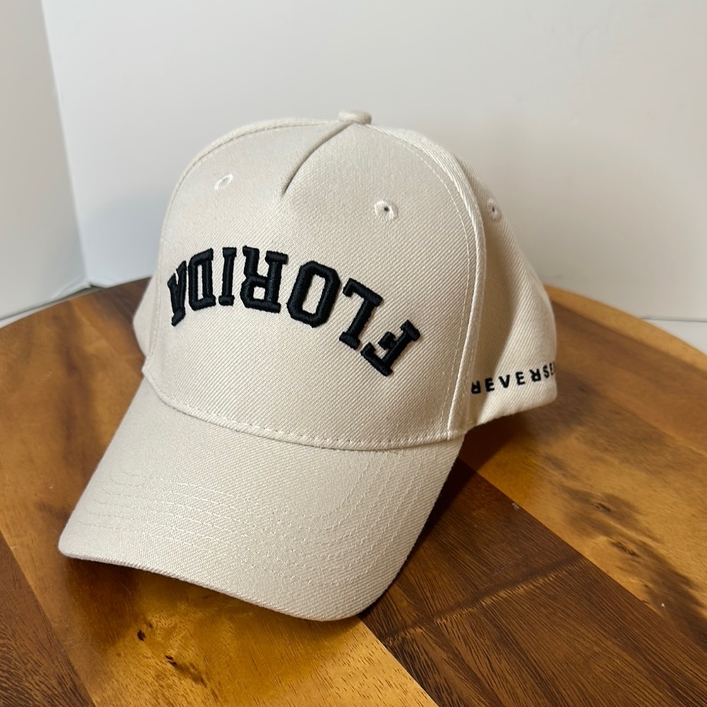 Florida Upside Down tan hat by Reversed. Logo on side and R on SnapBack.